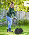 Woman using Heavy Duty 38L Push And Tow Lawn Roller With U Handle Water Or Sand Fill Steel Construction for lawn care