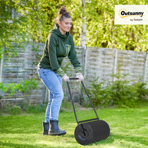 Woman using Heavy Duty 38L Push And Tow Lawn Roller With U Handle Water Or Sand Fill Steel Construction for lawn care