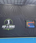 Spacious Portable Inflatable Golf Simulator Enclosure Matte Black with screen, shown indoors, 15Wx12Hx16.5D ft PVC tarpaulin.