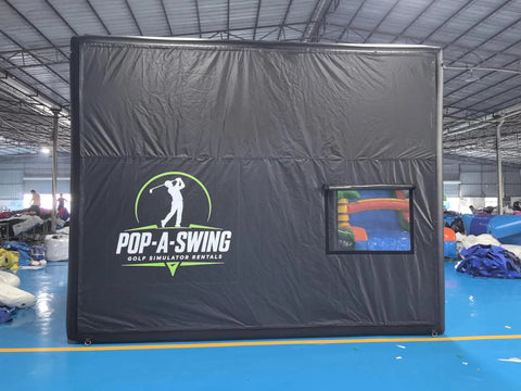 Spacious Portable Inflatable Golf Simulator Enclosure Matte Black with screen, shown indoors, 15Wx12Hx16.5D ft PVC tarpaulin.