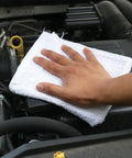 Hand cleaning car engine with Heavy Duty 100 Percent Cotton Terry Cloth Rags Bulk Pack Of 7500, Absorbent Cleaning Towels, White.