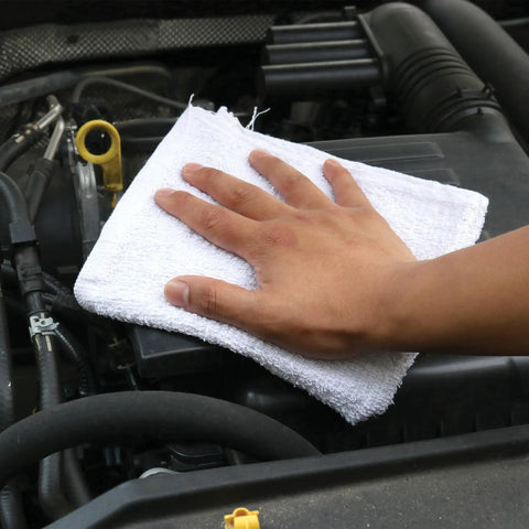 Hand using Mega Absorbent Terry Cloth Rags Pack Of 60 14 By 17 Inches 100 Percent Cotton Cleaning Towels for auto cleaning