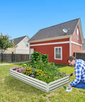 Man gardening beside Two Pack Galvanized Raised Garden Bed Kit 6 By 3 By 1 Feet Metal Planter For Flowers Vegetables And Herbs.