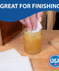 Person using Top Notch 10 Pack Of 6 X 9 White Non Scratch Non Woven Buffing Pads For Wood Finishes and Wax Application.