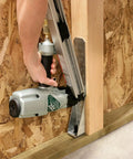 Person using nailer to attach metal connector with N10DHDGPT2500 Strong-Drive 33 SCN Smooth-Shank Connector Nail 2500 Count