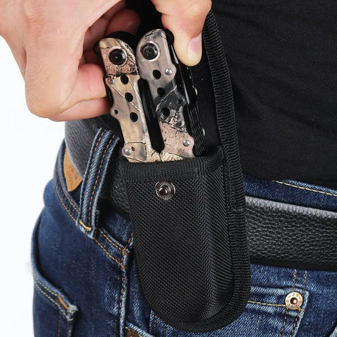 Person inserting 13 In 1 Outdoor Folding Multitool Pliers in Camo into a black nylon sheath on belt