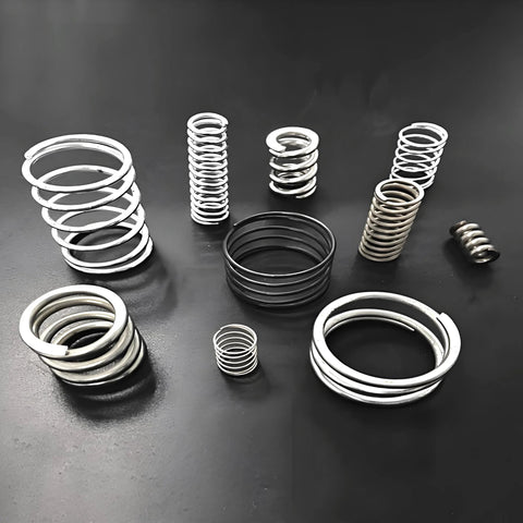 Group of stainless steel music-wire springs in varying diameters with a full-hard finish
