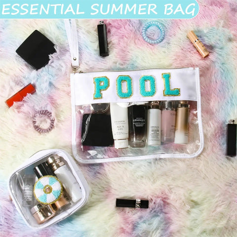 Two Pack Clear PVC Cosmetic Pouches With Chenille Letter Patches filled with toiletries on a fluffy background