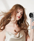 Woman using Diamond Studded Portable Handheld Turbo Fan With Glitter Rhinestones, Ultra Quiet USB Desk Fan, High Speed Cooling, Silver.