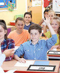Students in classroom using 36 Piece Composition Desk Name Plates For Classroom 9.5 By 3 Inch Black And White Reusable Name Tags