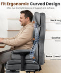 Man sitting in Boss Level Big And Tall Office Chair With Footrest And Lumbar Support, showing ergonomic design. Gray color.