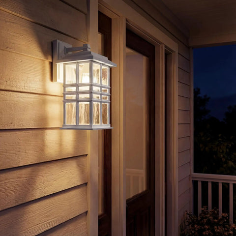 Craftsman Style Outdoor Wall Light In White 12 Inch Tall Exterior Sconce With Clear Hammered Glass One Light Porch Lighting For Patio Or Entry Built Tough Mission Glow, side view at night
