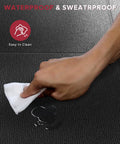 Hand wiping waterproof and sweatproof non slip treadmill mat for home gym setup, showing easy cleaning surface