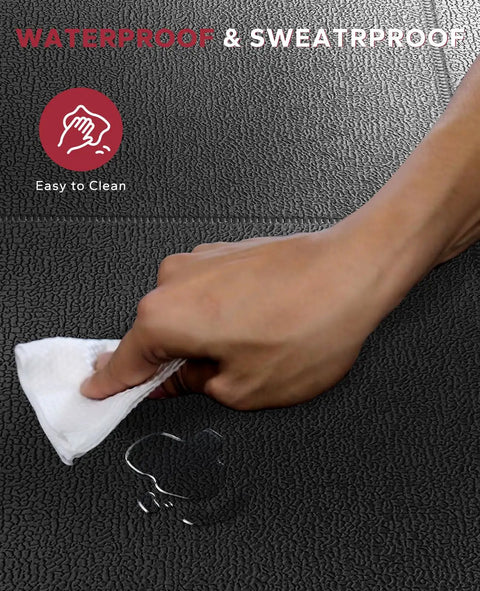 Hand wiping waterproof and sweatproof non slip treadmill mat for home gym setup, showing easy cleaning surface
