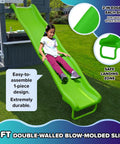 Child sliding down 8ft slide on 2-Story Cedar Outdoor Playhouse With 8ft Slide, Working Door, Play Kitchen, Mailbox And Doorbell