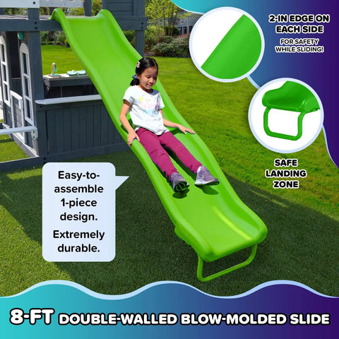 Child sliding down 8ft slide on 2-Story Cedar Outdoor Playhouse With 8ft Slide, Working Door, Play Kitchen, Mailbox And Doorbell