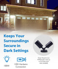 Dual Adjustable Heads Outdoor Flood Light Fixture Built Tough 100W 120V Weatherproof Heavy-Duty Aluminum Security Light Black Exterior Lighting Requires Two PAR20 Bulbs Up To 50W Each Not Included shown illuminating a garage in the dark.