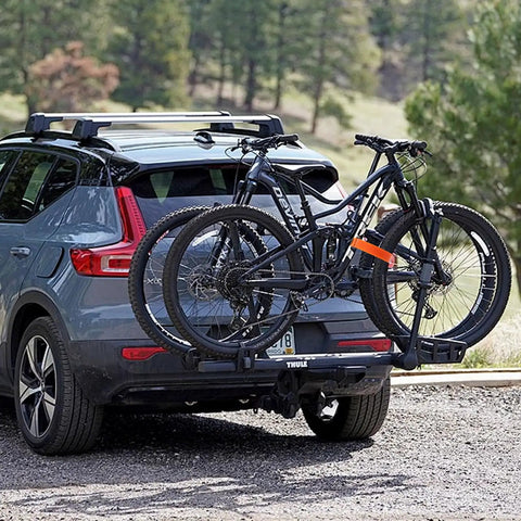 Car with bikes secured using 6 Pack Bike Rack Straps 60x2 Cm Adjustable Wheel Stabilizers and Hooks