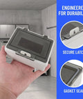 Rugged Push Button Protective Cover For Garage Door Control Panel, impact-resistant plastic enclosure with dust shield, shown in hand