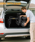 Man loading Electric Bike For Adults With 500W Motor 20 MPH Top Speed Foldable E Bike With 14 Inch Wheels into car trunk