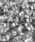 Close-up of silver metal grommets, 3/8 in (10 mm), 1000-piece bulk kit