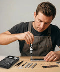 Person using All-In-One 115-In-1 Precision Screwdriver Set With 100 Bits And Opening Tools For Phones, Electronics Repair Kit shown