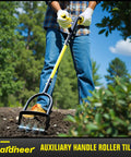 Person using Heavy Duty Rotary Cultivator For Gardening With Long Handle Workhorse Tiller For Soil Aeration Reseeding And Lawn Care
