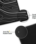 Close-up of Beastly 31.5 Inch Long Gaming Mouse Pad With Non Slip Base, showing durable stitched edges and anti-slip rubber base.