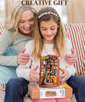 Child holding Dark Academia Book Nook Kit With LED Light 3 Hour Easy Build 3D Wooden Puzzle For Adults Beginner Friendly DIY Miniature