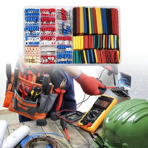 Heavy Duty 678 Piece Crimping Tool Kit With Assorted Cold Press Terminals And Heat Shrink Tubing For Electrical Wiring Projects laid out on tools and workspace.