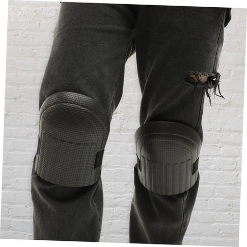 Built Tough Four Pack Black Heavy Duty Knee Pad Inserts For Work Pants Anti Slip Grip on worn jeans, providing support for work activities.