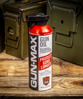12 Ounce All In One Gun Oil And Cleaner Heavy Duty Lubricant And Rust Protectant Bottle on wooden table with ammo boxes