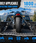 Tough As Nails Retractable Ratchet Straps 4 Pack Heavy Duty Tie Down Cords securing a motorcycle in a truck bed.