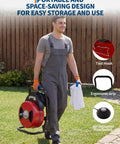 Man carrying 50 Foot By Half Inch Automatic Feed Drain Cleaning Machine Sewer Snake Auger With Cutter, ergonomic grip.
