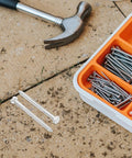 Toilet Tank Bolts And Gasket Kit Replacement Screws Set For Easy Install No Fuss Durable Toilet Hardware With Gasket Seals The Ultimate Toilet Repair Kit For Seats Tanks And Covers. metal bolts and screws in tray with hammer