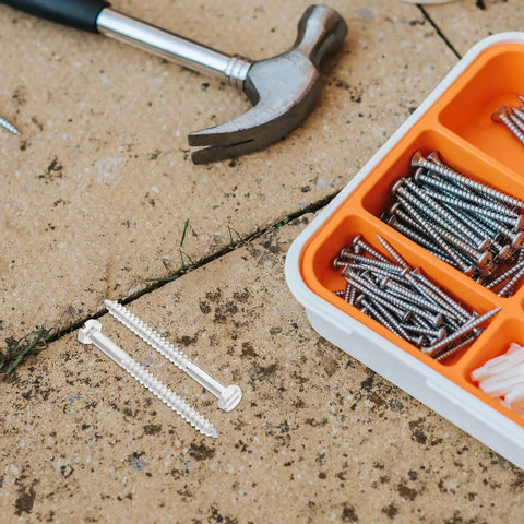 Toilet Tank Bolts And Gasket Kit Replacement Screws Set For Easy Install No Fuss Durable Toilet Hardware With Gasket Seals The Ultimate Toilet Repair Kit For Seats Tanks And Covers. metal bolts and screws in tray with hammer