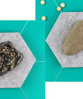 Rock key hider faux stone with hidden slot for spare keys in the garden or by the garage, brown and gray options on hexagonal tiles.
