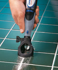 Grout Removal Rotary Tool Attachment For Tile Grout Lines With A 30 Degree Cutting Angle Centered Guides Large Visibility Window in use on tile floor.