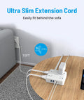 Ultra Thin Flat Plug Surge Protector Power Strip With 10ft Cord Eight Outlets and USB Ports behind sofa