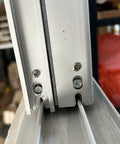Close up of Rock Solid 304 Stainless Steel Machine Screws 20 Pack Quarter Inch By Twenty Threads in aluminum profile assembly.