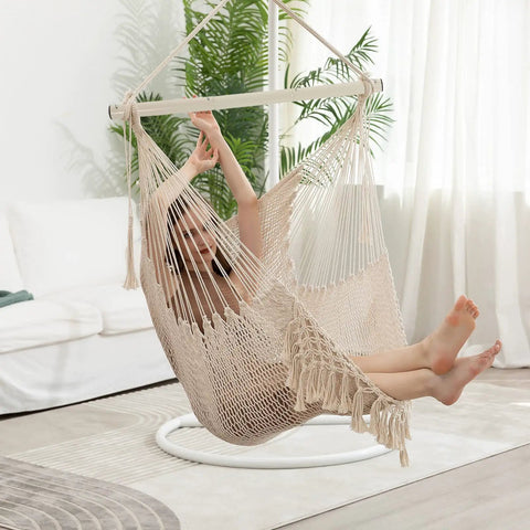 Cozy Cotton Rope Hammock Chair With 330Lb Weight Capacity, soft beige hanging swing in living room setting.