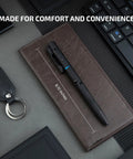 O'Pen 3 EDC Pen Light Go-To 4 in 1 Bolt Action USB C Rechargeable Flashlight resting on leather notebook