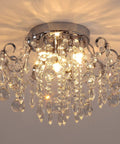 Small Crystal Chandelier Flush Mount Ceiling Light Three Light Modern Sleek Chrome Iron Raindrop Fixture shining brightly