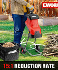 Heavy Duty 15 Amp Wood Chipper Shredder Mulcher With 1.77 Inch Cutting Capacity Four Steel Blades And 15 to 1 Reduction next to branches and mulch bag outdoors