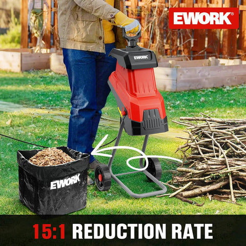 Heavy Duty 15 Amp Wood Chipper Shredder Mulcher With 1.77 Inch Cutting Capacity Four Steel Blades And 15 to 1 Reduction next to branches and mulch bag outdoors