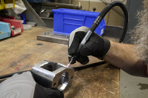 Using Air Pencil Grinder Pro Grade Tool With One Eighth Inch Collet And Burr on metal part at 60,000 RPM for precise deburring