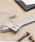 Stainless Steel Alignment Pins Set With Flat Cylindrical Design For Machinery Furniture And Electronics Easy To Install Through Precise Hole Positioning Durable Rust Resistant Headpins For Stable Positioning In Tools And Projects seen with wrench and bolts on fabric surface.