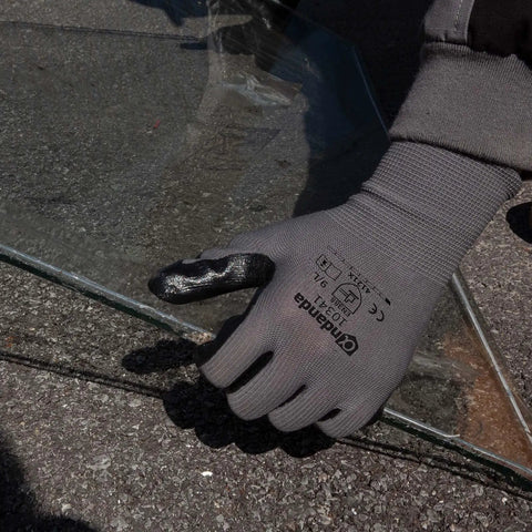 Smart Touch Work Gloves With Nitrile Grip Palm holding glass, seamless knit nylon, size large, tough for warehouse handling