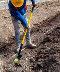 Worker using TruPro California Trenching Shovel With 4 Inch 13 Gauge Steel Blade in soil for pipe trenching
