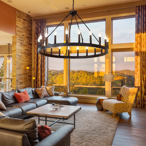 Black Wagon Wheel Chandelier 40 Inch With 20 Lights in cozy living room with high ceilings and vintage vibes.